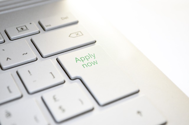 Computer keyboard with the words "Apply Now" on the enter key