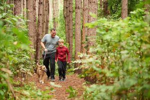Father and son walking in the words