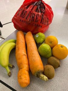 One of the red bags of produce that are sent home with PABS students.