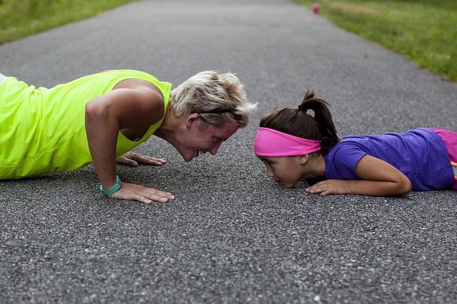 A mother and daughter exercise together