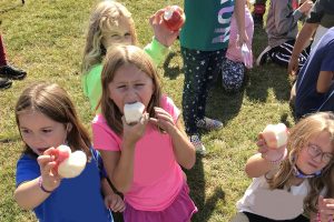 Students participate in an Apple Crunch Fall Festival facilitated by Traverse City Area Public Schools